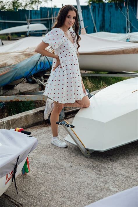 Beautiful Brunette Woman In Summer Dress By The Boat In The Yacht Club Stock Image Image Of