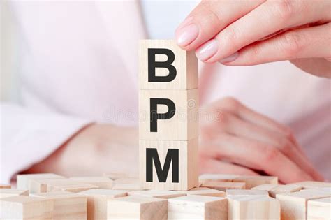 Three Wooden Cubes With Letters BPM Means Business Process Management