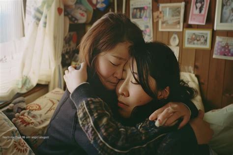 Portrait Of Asian Lesbian Couple Hugging Each Other In Bedroom Premium AI Generated Image