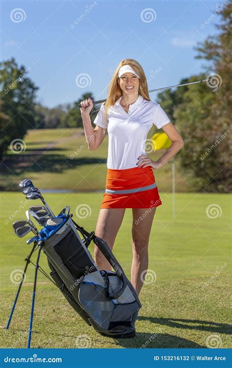 Lovely Blonde Female Golfter Enjoying A Round Of Golf On A Public Golf Course Stock Photo