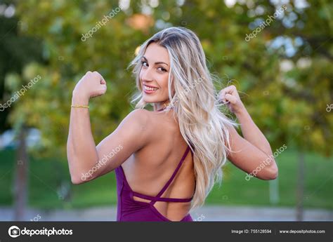 Smiling Blonde Athlete Woman Flexing Her Biceps Training Outdoor Park Stock Photo