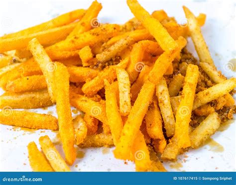 French Fries In White Paper Wrap On Wooden Floor Stock Image Image