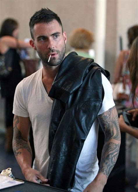 Adam Levine... I love a man that sucks on lollipops! LOL! Adam Levine ...