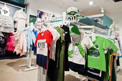 Free Photo Childrens Bright Clothes Hang On The Display In The Baby