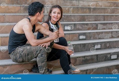 Adult Sportive Man With Naked Torso Is Sitting On Floor Folding Legs