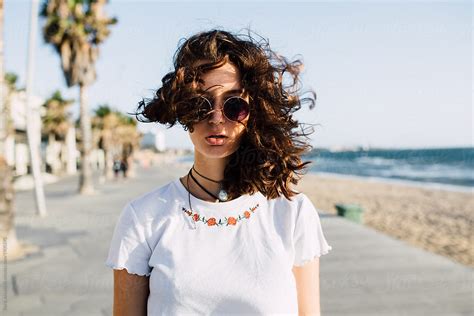Brunette Girl Posing At The Beach By Stocksy Contributor Boris Jovanovic Stocksy