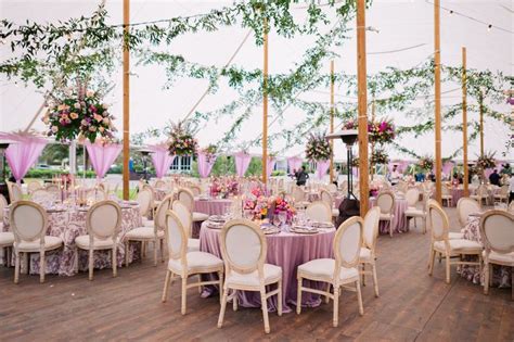 Outdoor Wedding Reception in a Purple-Themed Tent