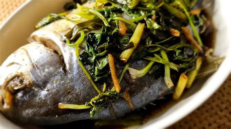 Steamed Fish Seasoned With A Simple Soy Sauce Along With Spring Onions