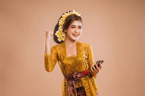 Premium Photo Excited Woman With Balinese Traditional Kebaya Costume