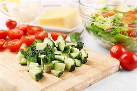 Premium Photo Female Hands Cutting Vegetables For Salad At Kitchen