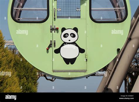 A Panda Was Painted On One Of The Cars Of A Ferris Wheel In