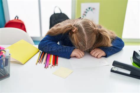 Adorable Blonde Girl Student Using Computer Sitting On Table At Classroom Stock Image Image Of