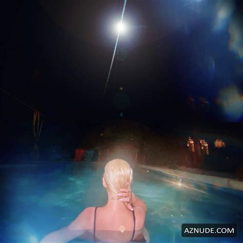 Christina Aguilera Displays Her Tits While Swimming In One Piece In The Pool For Her Social