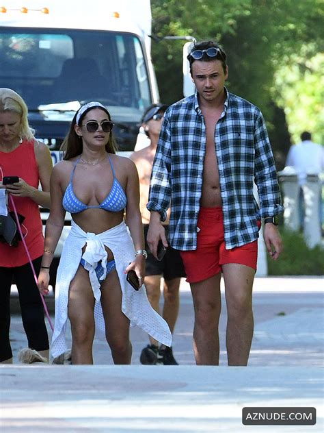 Courtney Green Wears A Blue Bikini As Boyfriend Calum Bushby Takes Photos Of Her On The Beach In