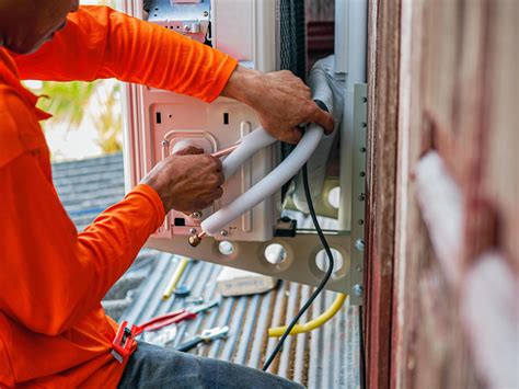 Air conditioning technicians install new compressor air in homes