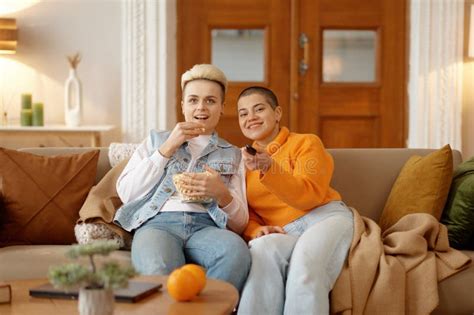 Cheerful Loving Lesbian Woman Couple Eating Popcorn Watching Movie On Tv Stock Image Image Of