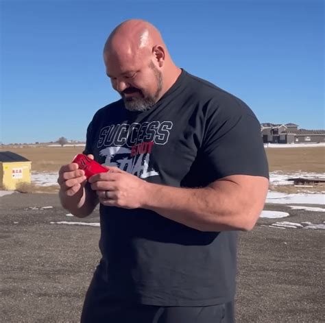 Brian Shaw Holding A 12oz Can Of Coke Rabsoluteunits