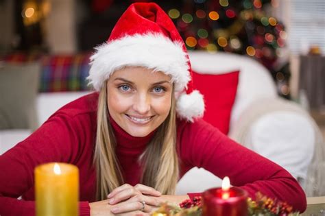 Premium Photo Portrait Of A Smiling Blonde In Hat At Christmas