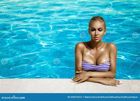 Beautiful Tanned Woman In Elegant Swimsuit In Pool Elegant Glamour Girl In Trendy Bikini Is