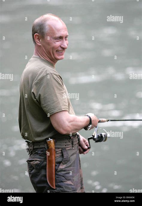 Russian President Vladimir Putin Fishing On The Khemchik River In The