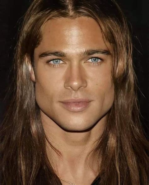 A Man With Long Hair And Blue Eyes