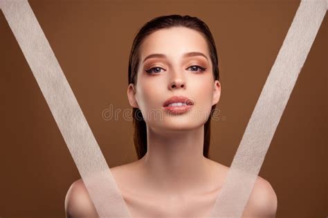 Photo Of Cute Shiny Woman Nude Shoulders Using Anti Wrinkles Tapes Beige Color Background Stock