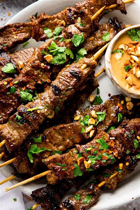 Tender Marinated Beef Satay Skewers With A Spicy Peanut Sauce Grill