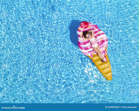 A Beautiful Blonde Girl Enjoys A Hot Summer Day In The Pool Stock Image Image Of Water