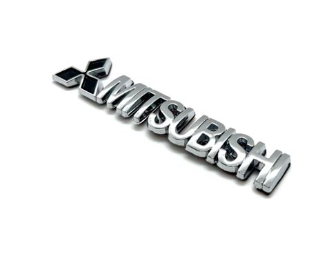 Эмблема ( Орнамент / надпись ) на крышку багажника Митсубиси 92 x 15 мм ...