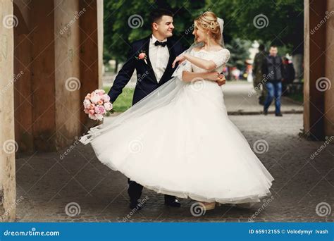 Happy Handsome Groom And Blonde Beautiful Bride In White Dress D Stock Image Image Of