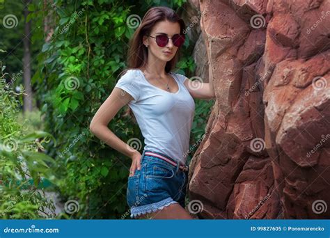 Portrait Of Sexual Brunette In Sunglasses And Jeans Shorts Stock Image Image Of Fashion Jeans