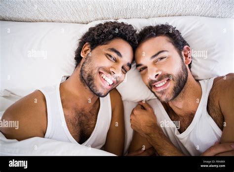Smiling Gay Couple On Bed Stock Photo Alamy