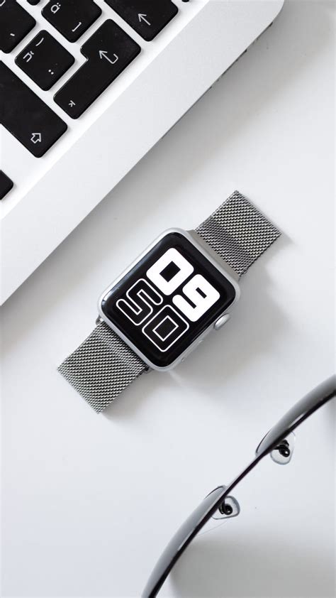 Smartwatch On A White Surface · Free Stock Photo