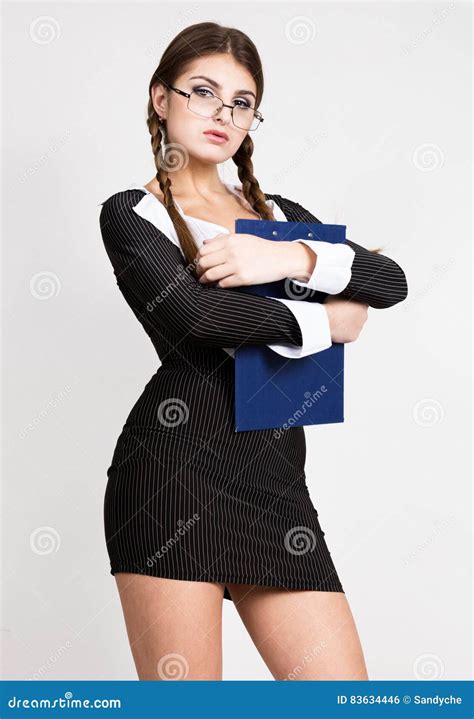 Secretary Portrait Of Beautiful Brunette Business Lady With Glasses And Wearing In Pinstripe