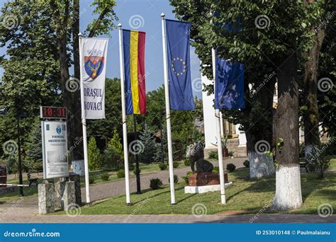 Flags Of Romania And Hungary Painted On Two Clenched Fists Facing Each