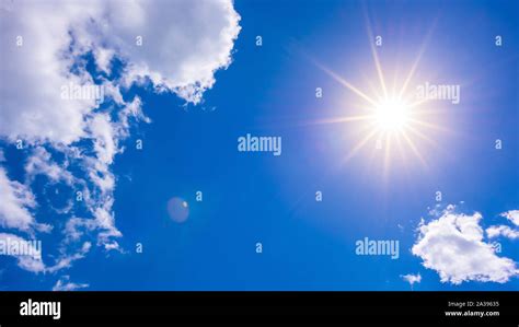Hot Summer Or Heat Wave Background Wonderful Blue Sky With Glowing Sun Stock Photo Alamy