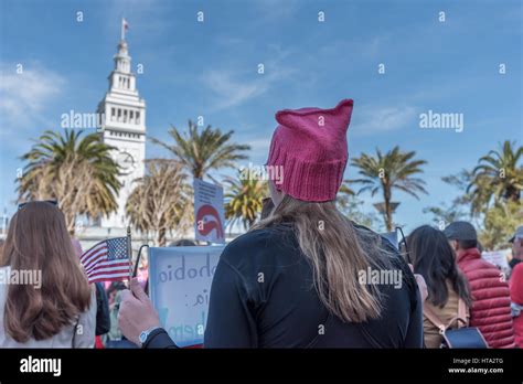 San Francisco USA 8th Mar 2017 A Woman Wears A Pink Pussy Hat And Holds An American Flag At
