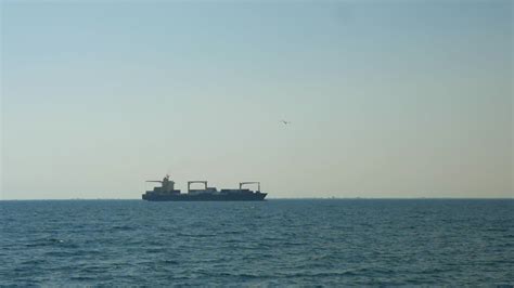 A Cargo Ship Drifting In The Sea 29045563 Stock Video At Vecteezy