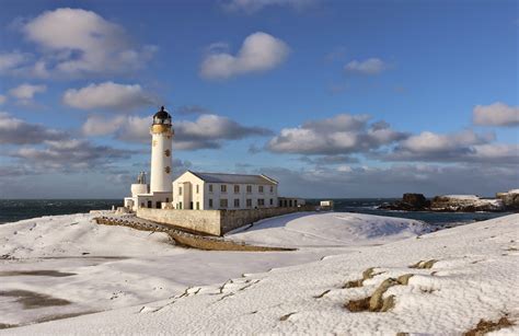 Fair Isle: February's Photos - Snow, Lighthouse, and Malcolm's Head.