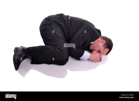 Businessman laying down in fetal position. Image is isolated on white ...