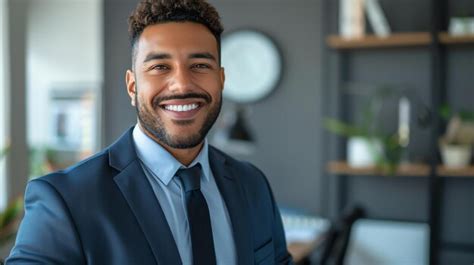 Headshot Of A Successful Young Businessman Smiling At The Camera He Is