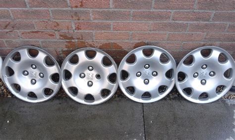 Full Set Of Genuine Peugeot Wheel Trims In Swansea Gumtree