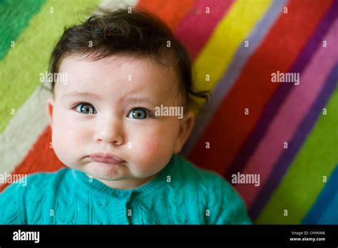 Beautiful Baby Girl with brown hair and blue eyes Stock Photo - Alamy