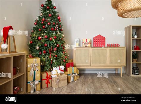 Interior Of Living Room With Glowing Christmas Tree Presents And
