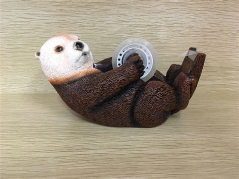 animal that falls in love with a tape dispenser 11