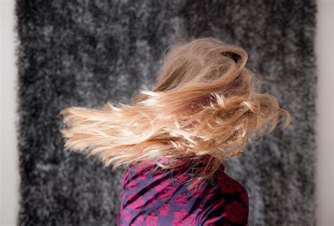 Premium Photo Side View Of Woman Tossing Blonde Hair