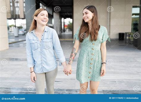 Gay Couple Smiling And Holding Hands Stock Photo Image Of Bisexual Date