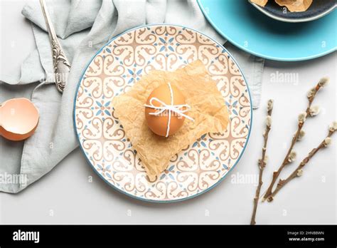 Beautiful Table Setting With Pussy Willow Branches For Easter Celebration On White Background