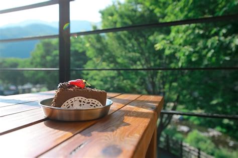 Premium Photo Eating Chocolate Strawberry Cake Outdoors Will Give You