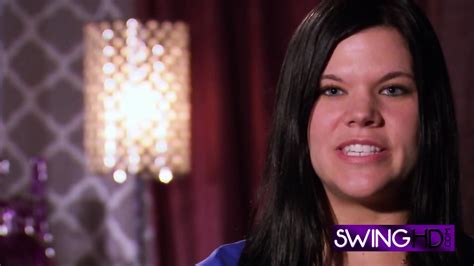 Big Fake Tits Swinger Kisses Another Man